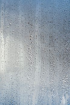 Background with drops on glass, genuine. Plenty of space for text.