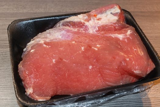 Raw pickled juicy marinated Sauerbraten Meat.