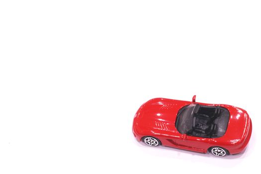 Red toy car  on a white background