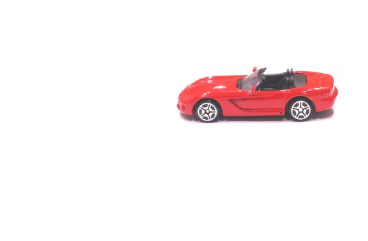 Red toy car  on a white background