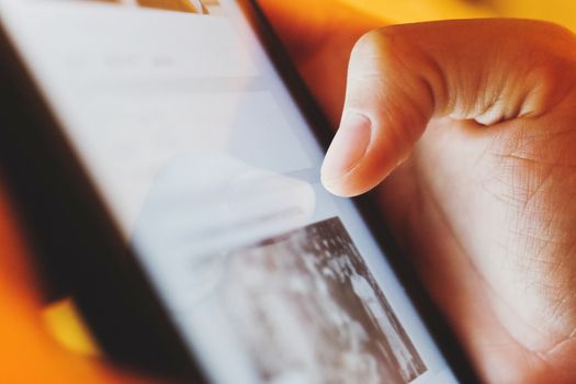 image of hand using digital tablet close up, social media life