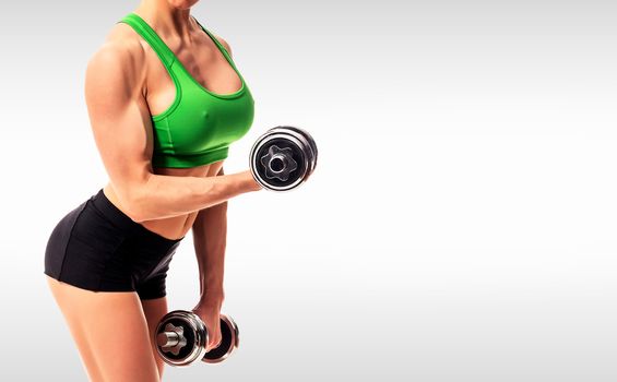 fitness woman with barbells on grey background