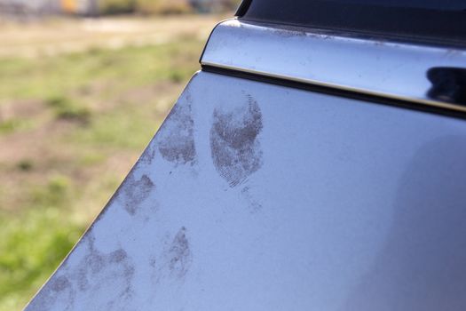 Automobile theft. Evidence on the door of a car in the form of fingerprints