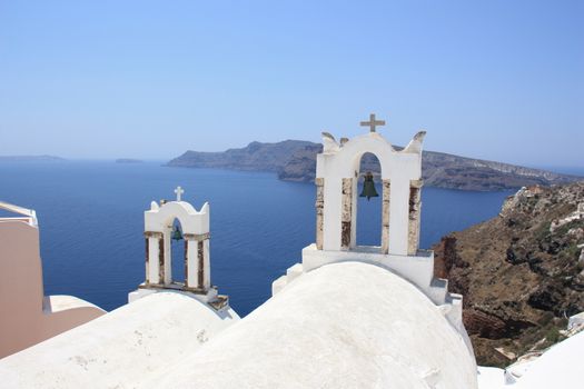 Bell towers of a chapel, Oia, Santorini, Greece.