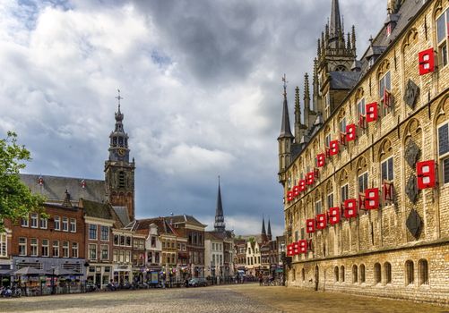 Market square with gothic city hall by day in Gouda, South Holland, Netherland