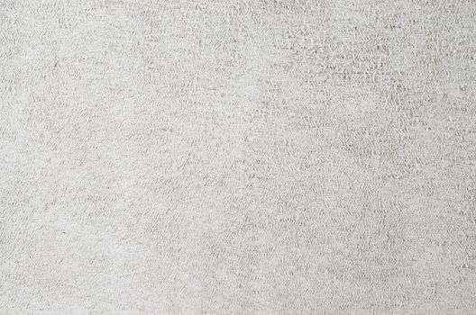 Light grey suede soft leather as texture background. Close up shammy leather texture