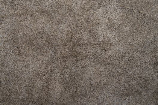 Dark brown suede soft leather as texture background. Close up shammy leather texture