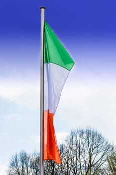 Italy flags on a flagpole against white background