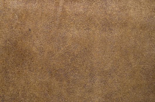 Brown suede soft leather as texture background. Close up shammy leather texture