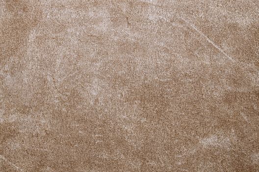 Brown suede soft leather as texture background. Close up shammy leather texture
