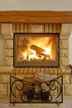 Roaring flames in modern fireplace