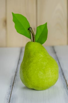 Fresh pears on the wooden background. Still life