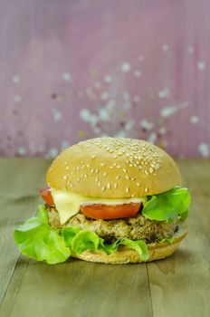 Closeup of home made burgers on wooden background