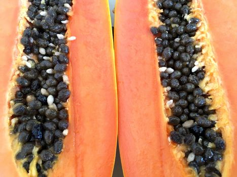 Background of papaya, ripe fresh yellow papaya sliced isolated.