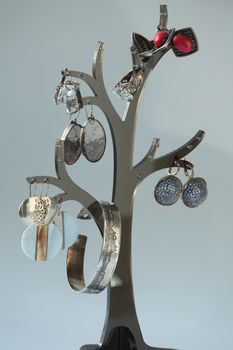 collection of vintage jewelry on tree