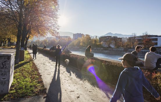 INNSBRUCK, AUSTRIA – NOVEMBER 1st 2015: Colorful day on this summer afternoon by the river in Innsbruck