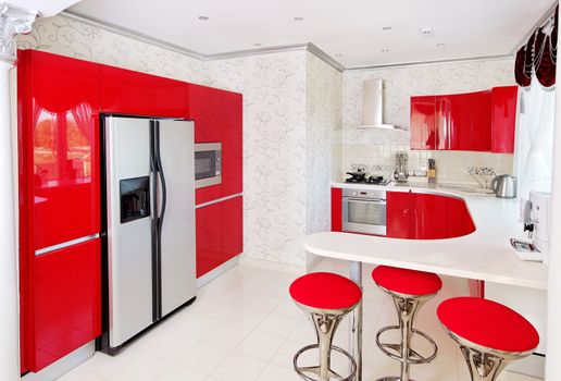 Modern red glossy kitchen interior 