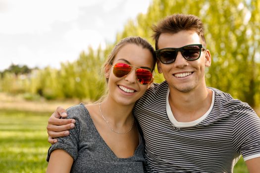 Portrait of a happy young couple embraced