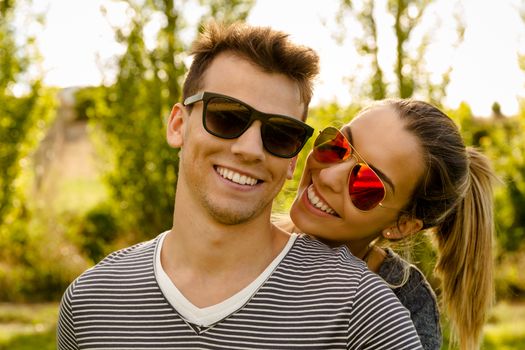 Portrait of a happy young couple embraced