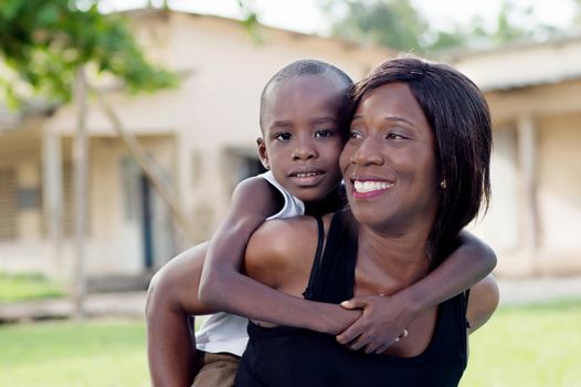 This young woman is happy to carry her child onher back.