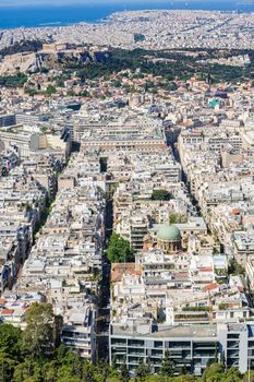 Athens Greece - April 27, 2016: Famous view from Lycabettus hill to modern city with Acropolis ans sea at background