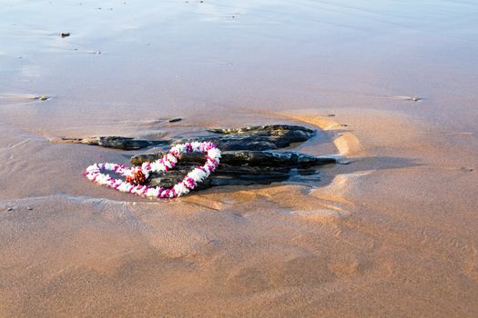 Garland on the beach at the ocean