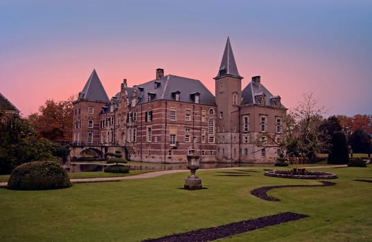 Late medieval castle 'Twickel' near Delden in the Netherlands at sunset

