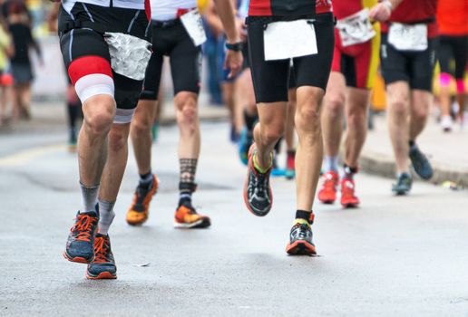 Group of marathon runners on the street.