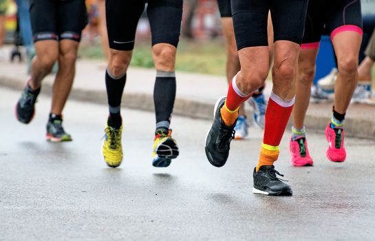 Group of marathon runners on the street.