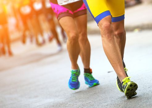 Group of marathon runners on the street.