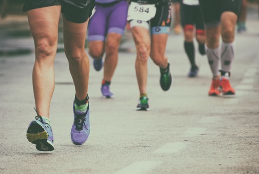 Group of marathon runners on the street.