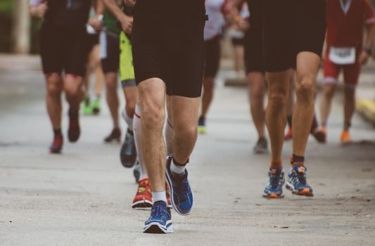 Group of marathon runners on the street.