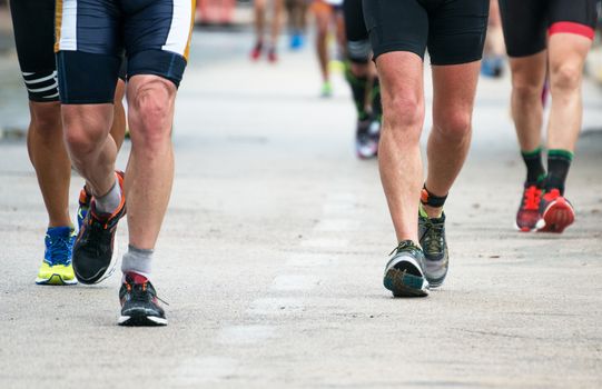 Group of marathon runners on the street.