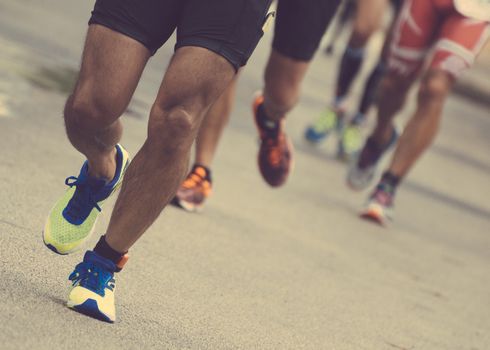 Group of marathon runners on the street.