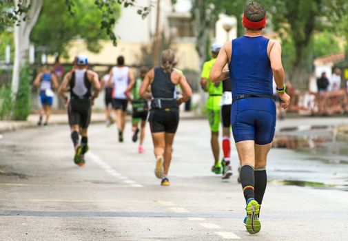 Group of marathon runners on the street.