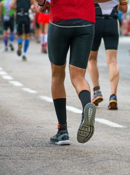 Group of marathon runners on the street.