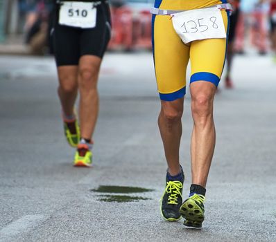 Group of marathon runners on the street.