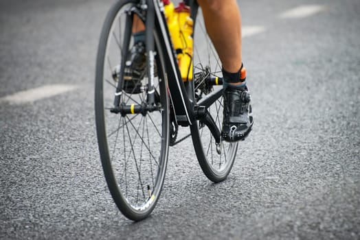 Unrecognizable professional cyclist during the bicycle competition.