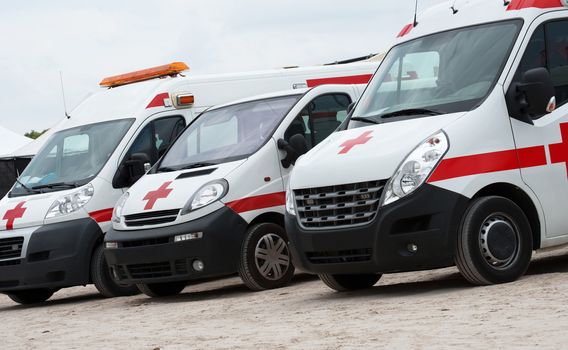 Ambulance cars parked on the beach.