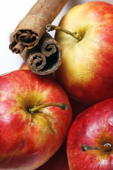 Red apples in drops close-up on a white background