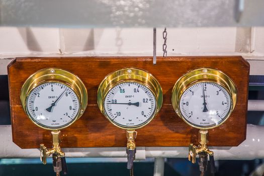 Old bronze ship instruments at a ship on the german river elbe