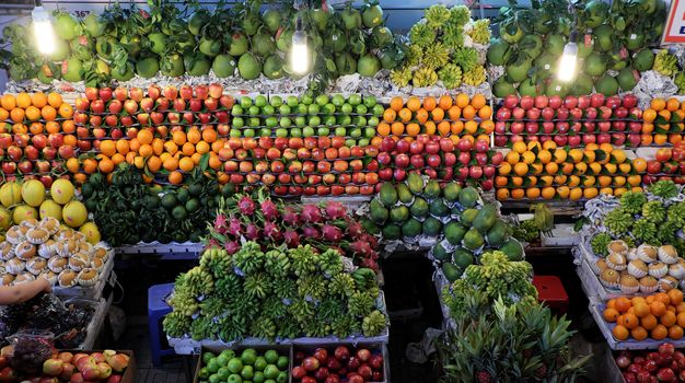 Colorful of fruit shop at Dalat marketplace, Vietnam, many kind of fresh tropical fruits arrange so amazing, agriculture product at farmer market