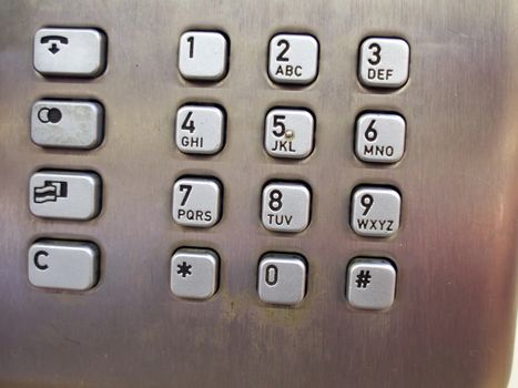Close details of traditional modern public telephone keypad
