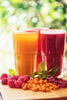 set of fruit non-alcoholic drink with cranberries raspberries and sea buckthorn