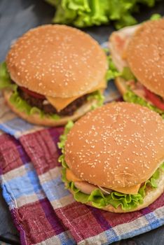 Closeup of home made burgers on wooden table