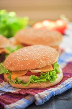 Closeup of home made burgers on wooden table
