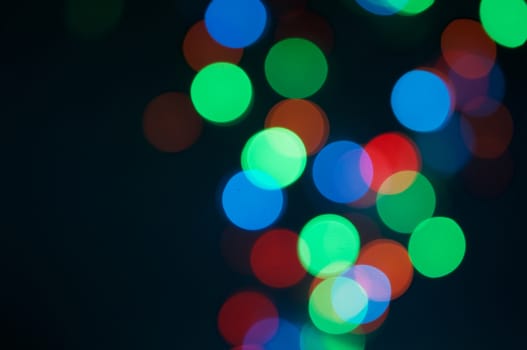 Big colorful bokeh circle or defocused of glitter at night as background.