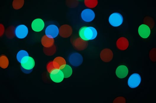 Colorful bokeh circle or defocused of glitter at night as background.