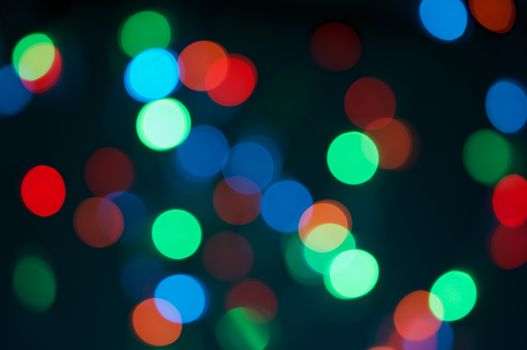 Colorful bokeh round or defocused of glitter at night as background.