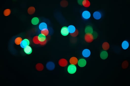 Defocused of colorful glitter or bokeh circle at night as background.